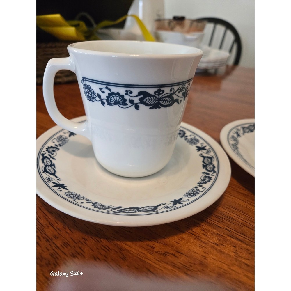 Corelle olde time pattern cups and saucers. 2 each.