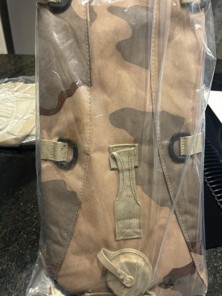 Two KMS Camo Hydration Backpacks