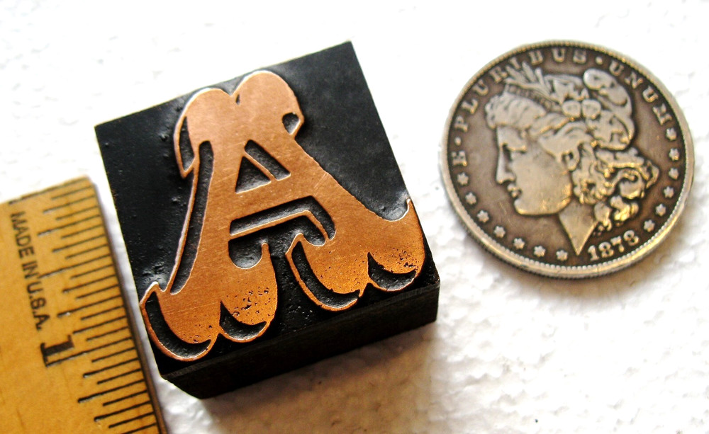 Copper faced ornate letter UC A