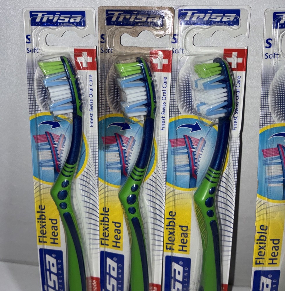 23 Trisa Flexible Head Toothbrushes/ All New