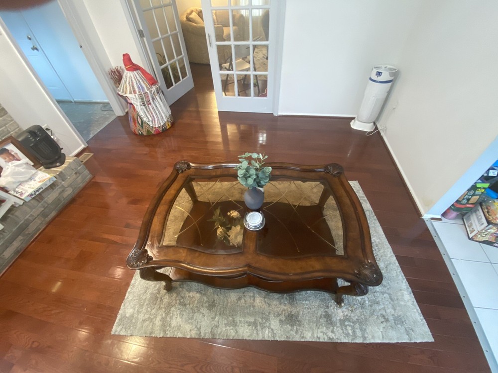 A Set Of Beige Sofas And A Coffee Table