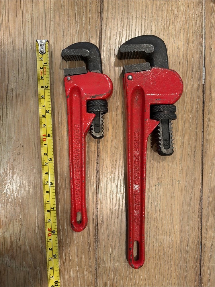 Two Pipe Wrenches 8” And 12”
