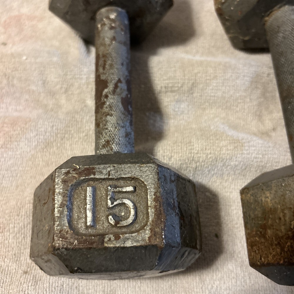 Three 15 Pound hex Head Cast Iron Dumbbells Silver