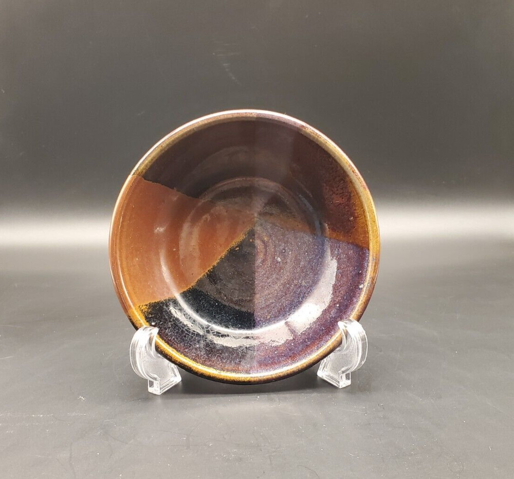 Art pottery bowl with geometric pattern signed