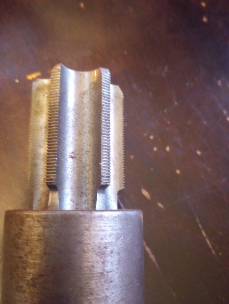 spindle shaft with tap for machining