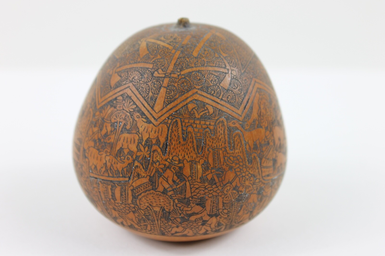 One exquisitely carved Peruvian storytelling gourd village life folk art