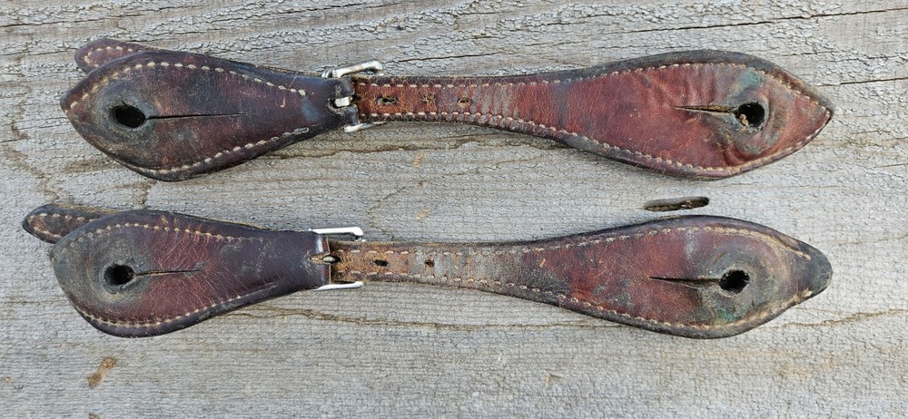 nice leather doubled-and-sewn formed-over-button spur straps