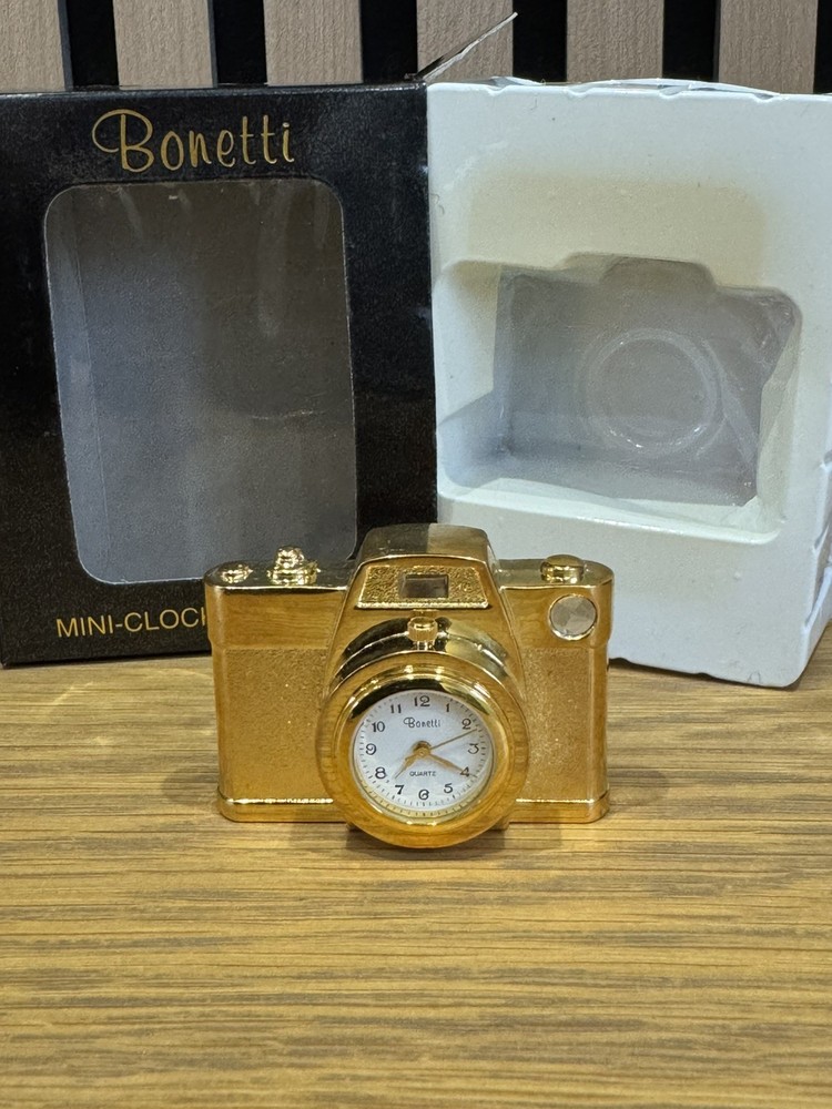 Bonetti Clock Collection comprising 7 boxed gold finished analogue mini-clocks