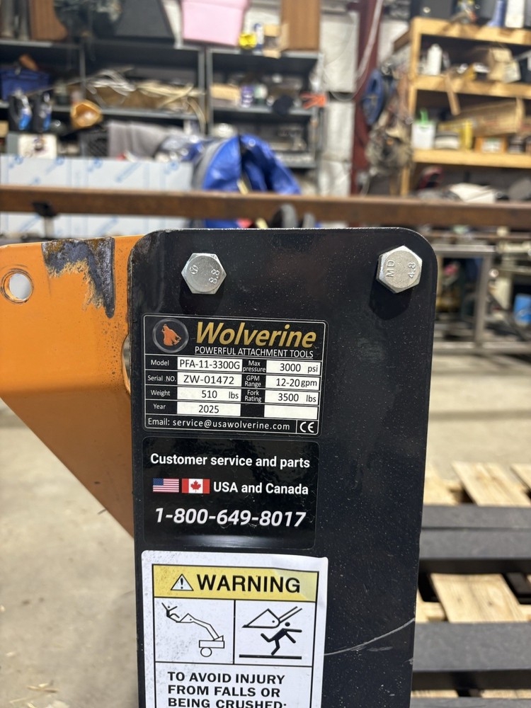 skid steer forks with hydraulic width adj.