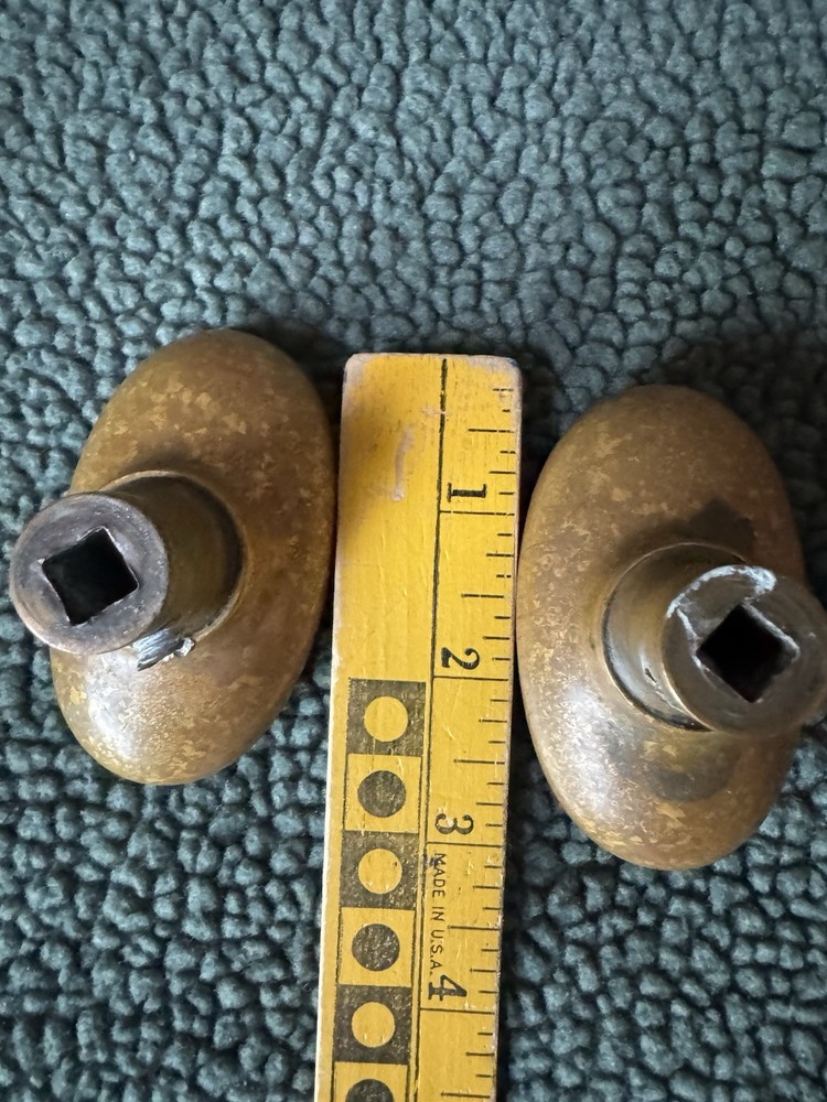 Antique Victorian Brass Oval Door Knobs Shield & Belt Garter Design