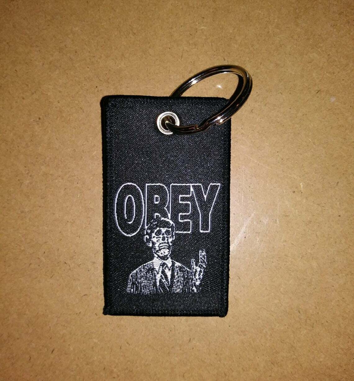 KEYCHAIN - They Live - HORROR / sci-fi, OBEY, John Carpenter, zipper pull tag