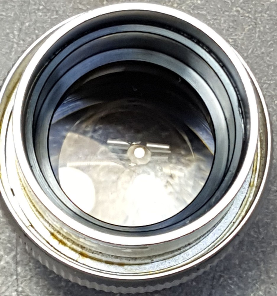SW10X Microscope Eyepiece. We don’t know what machine it was pulled from.