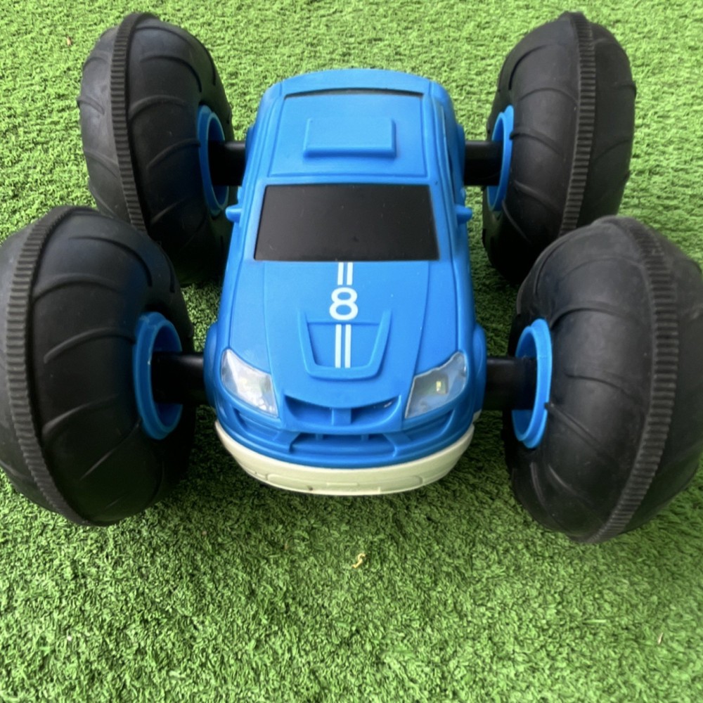 Remote-Controlled Stunt Car Blue White Black Oversized Wheels LED Lights
