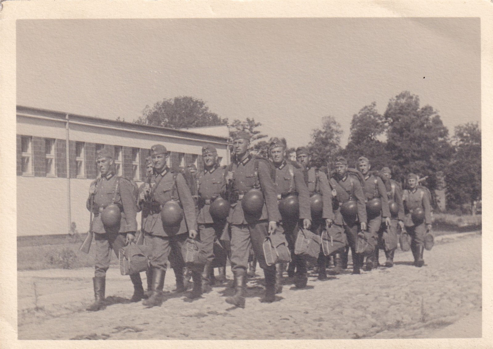 Original WWII RPPC Real Photo Postcard GERMAN INFANTRY RIFLES HELMETS MARCH 1013