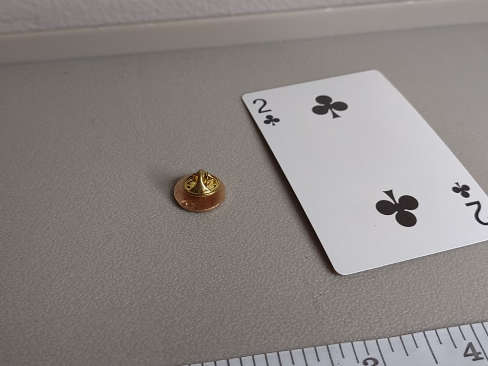 Round Gold Tone And Green Leaf Pin