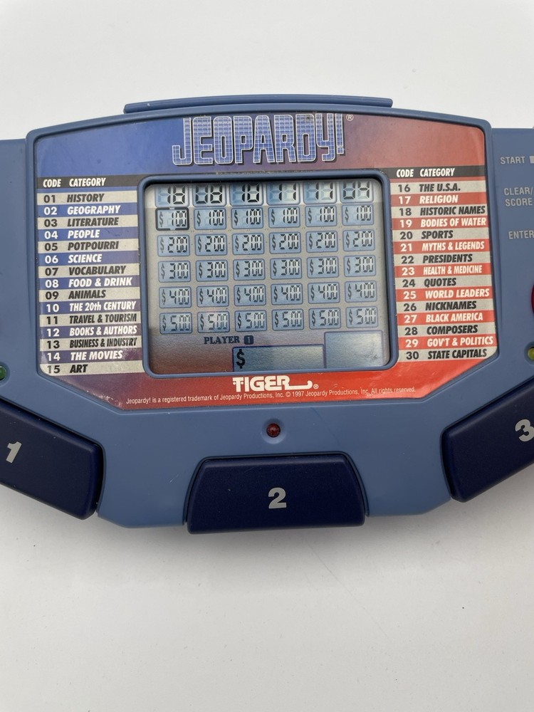 Tiger Electronics Jeopardy Hand Held Game 1995 with Answer Book & Manual E1