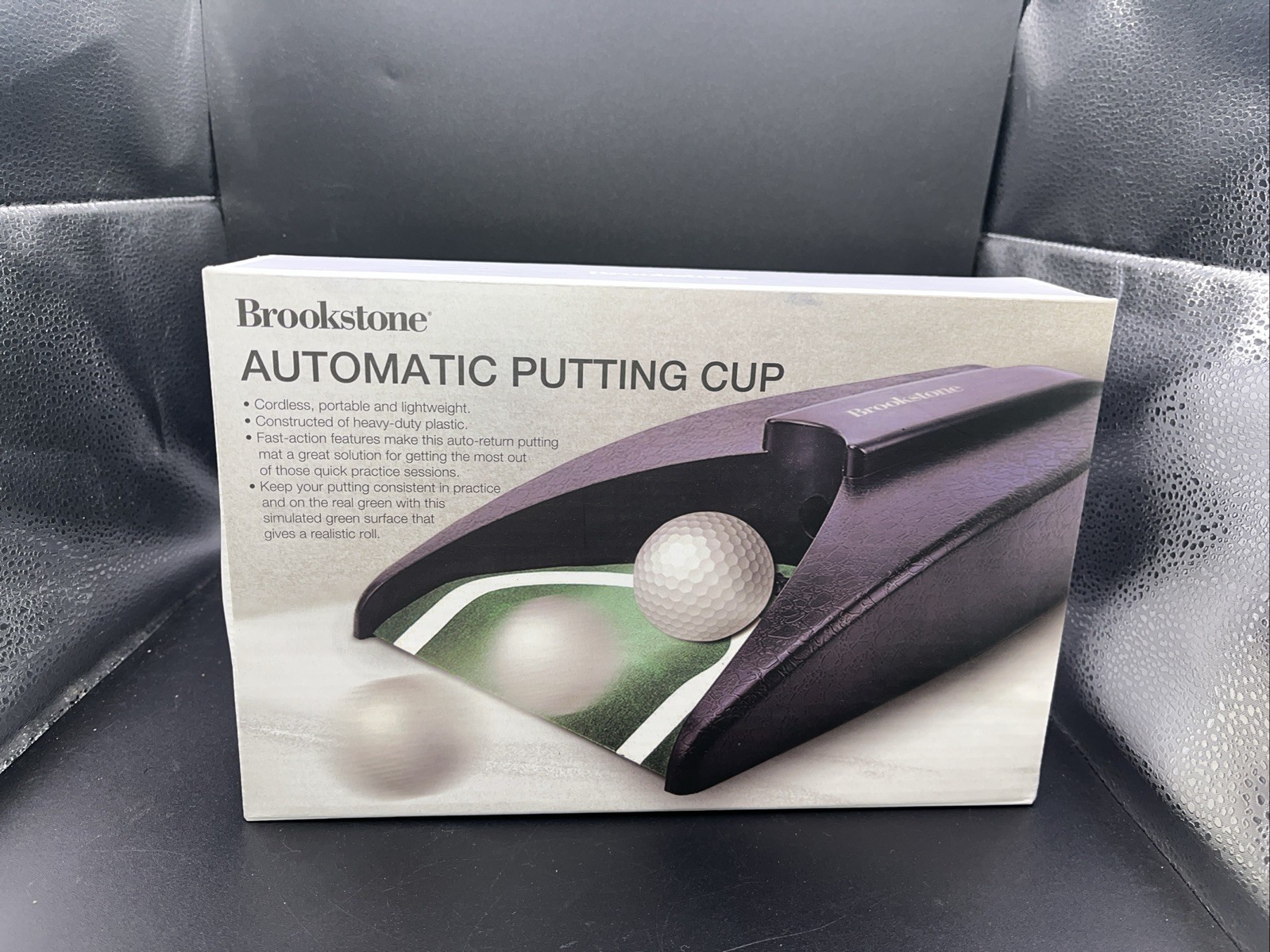 Brookstone  Automatic Return Putting Cup