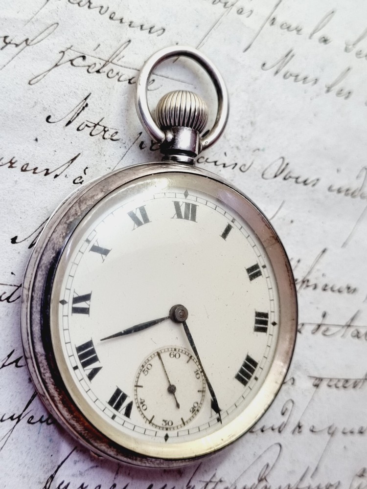 silver open face pocket watch