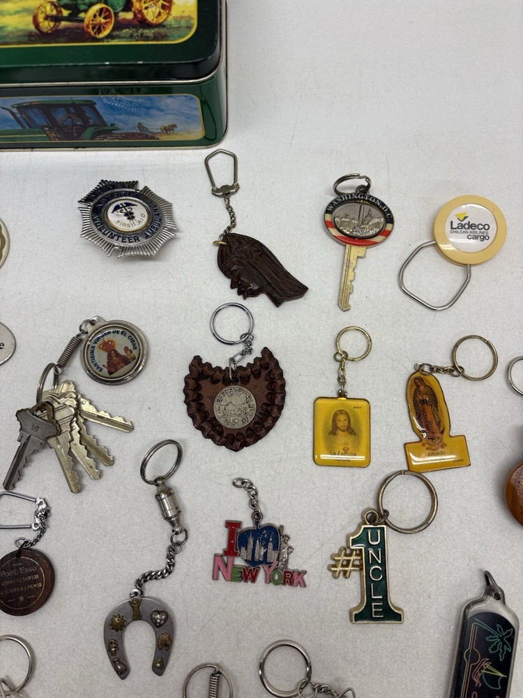 32 Vintage Key Chains And a John Deere Tin Box