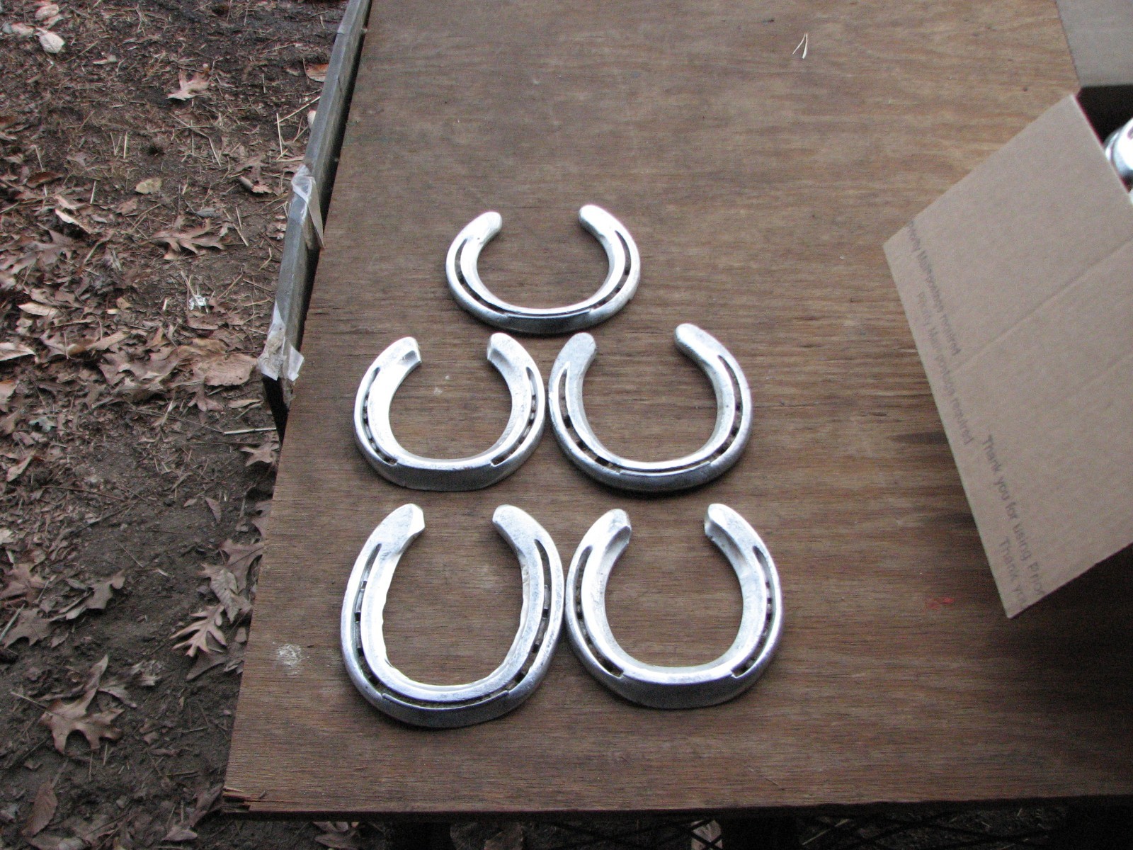 125 used aluminum horseshoes