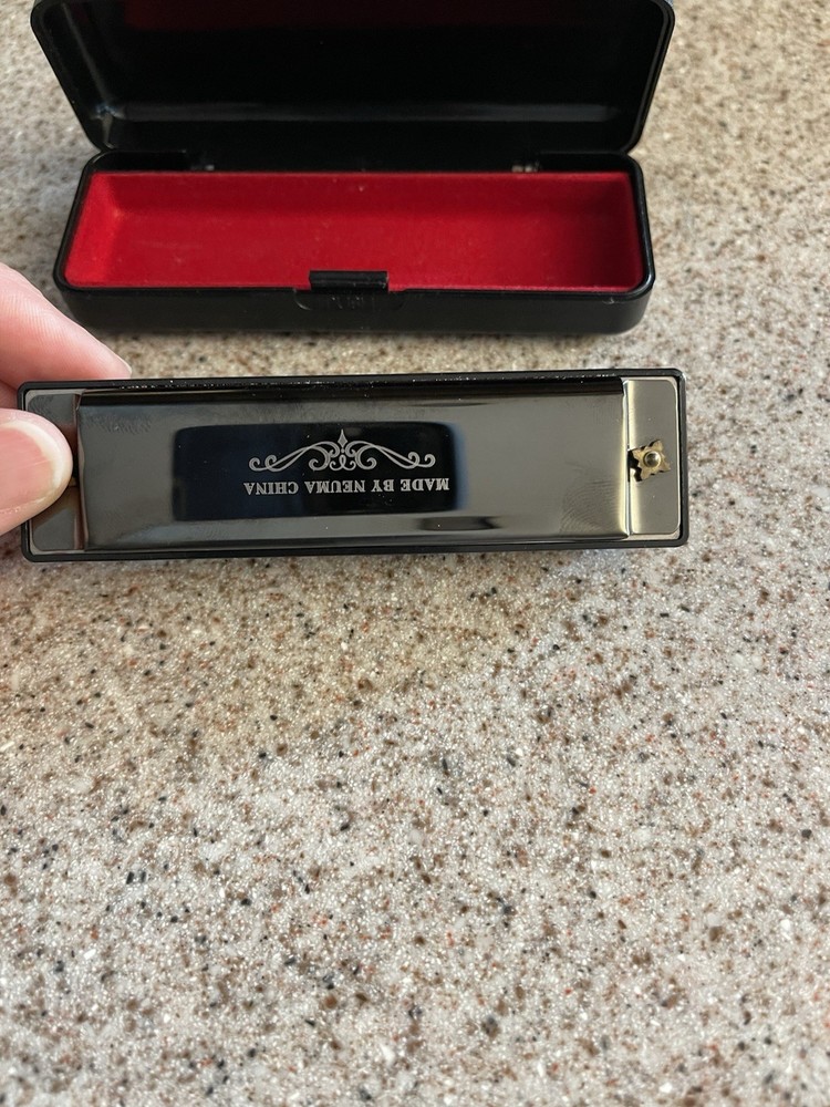 Neuma 10-Hole Blues Harmonica in a protective case