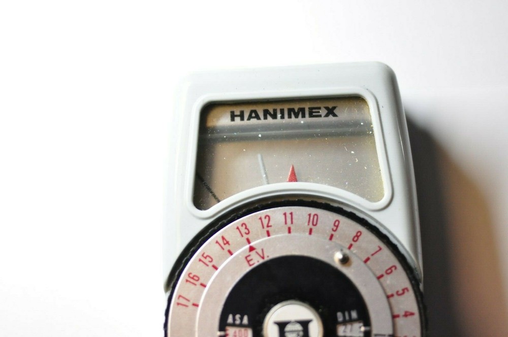 Hanimex model PR 125 light meter with strap and case.