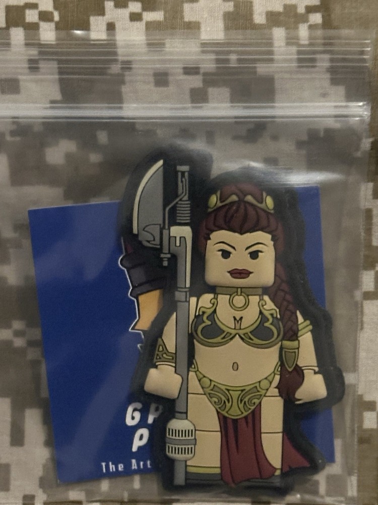 The Grumpy Pencil The Captive Brick Fig Pvc Patch