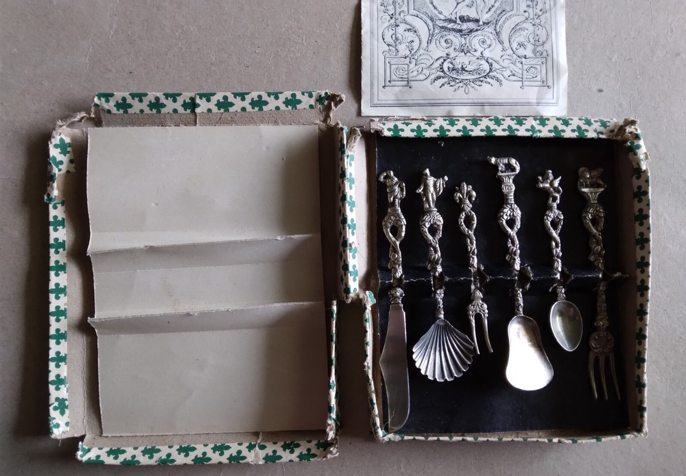 "Candlelight Silver" set from "Around-the-World Shoppers Club"--worn box, paper