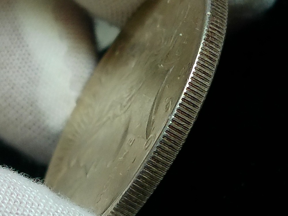 Raw 1923 Peace Silver Dollar - Philadelphia - Small Lamination Error