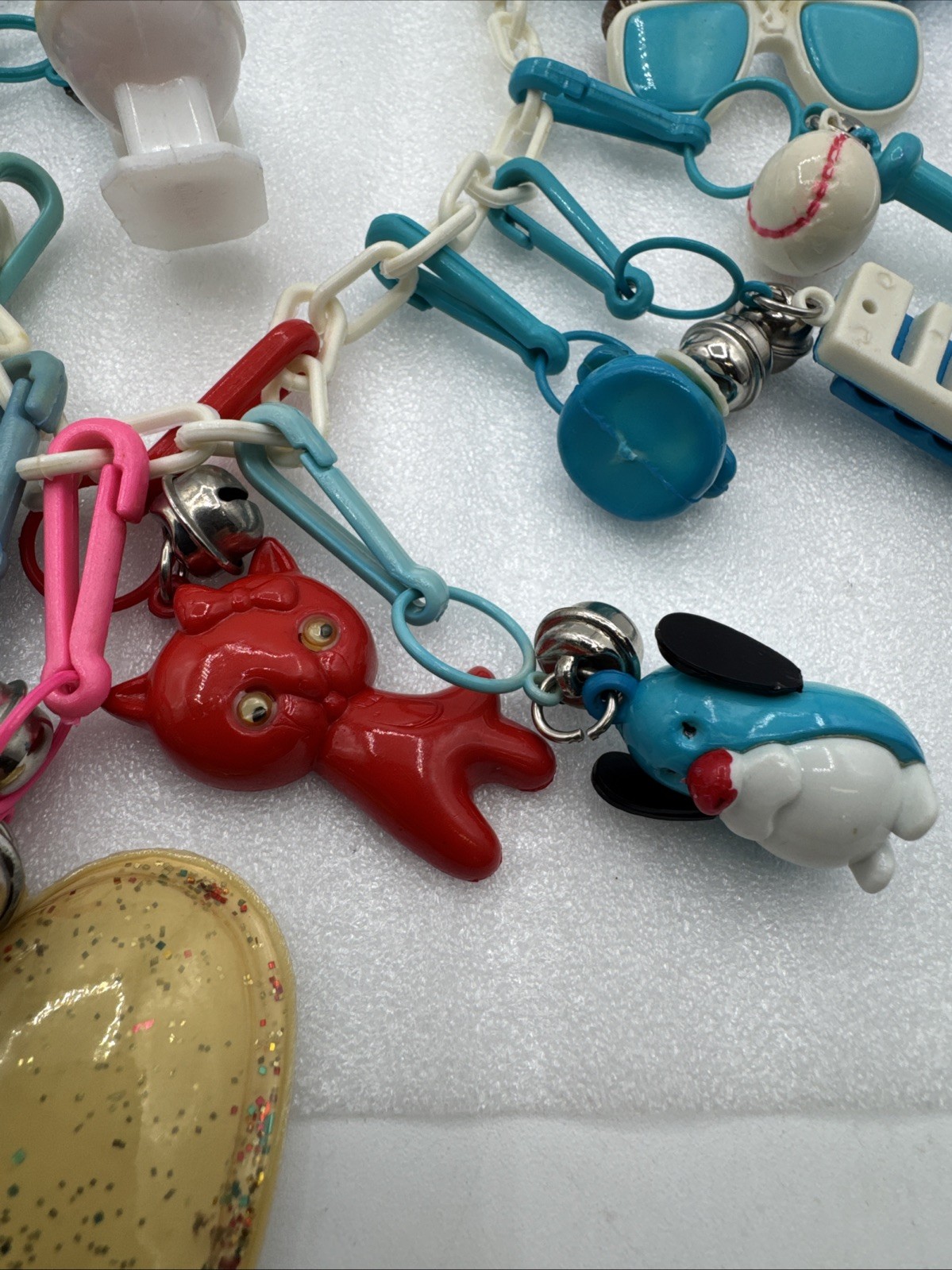 Vintage 1980's Plastic Bell Charm Clip Necklace w 2 Chains and 34 Charms.