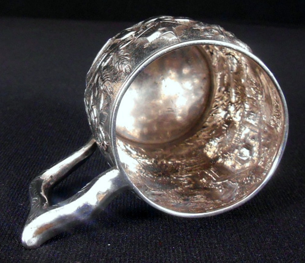 A solid silver child's mug, architectural repousse, S. Kirk & Son, 11 oz, c.1860