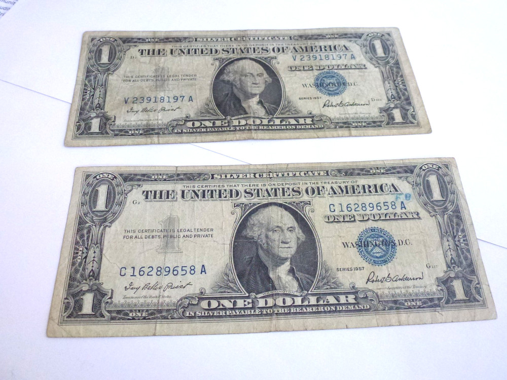 well worn silver certificates. $1.00 1957