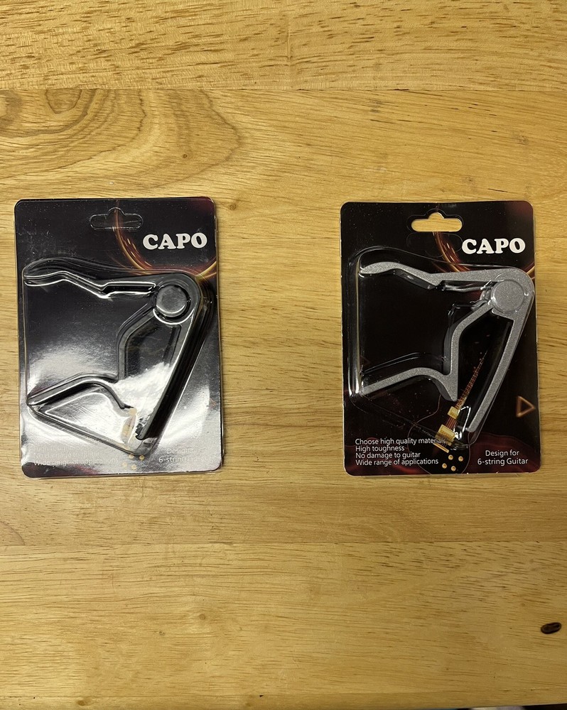 capo quick change spring loaded for acoustic , electric and nylon string guitars