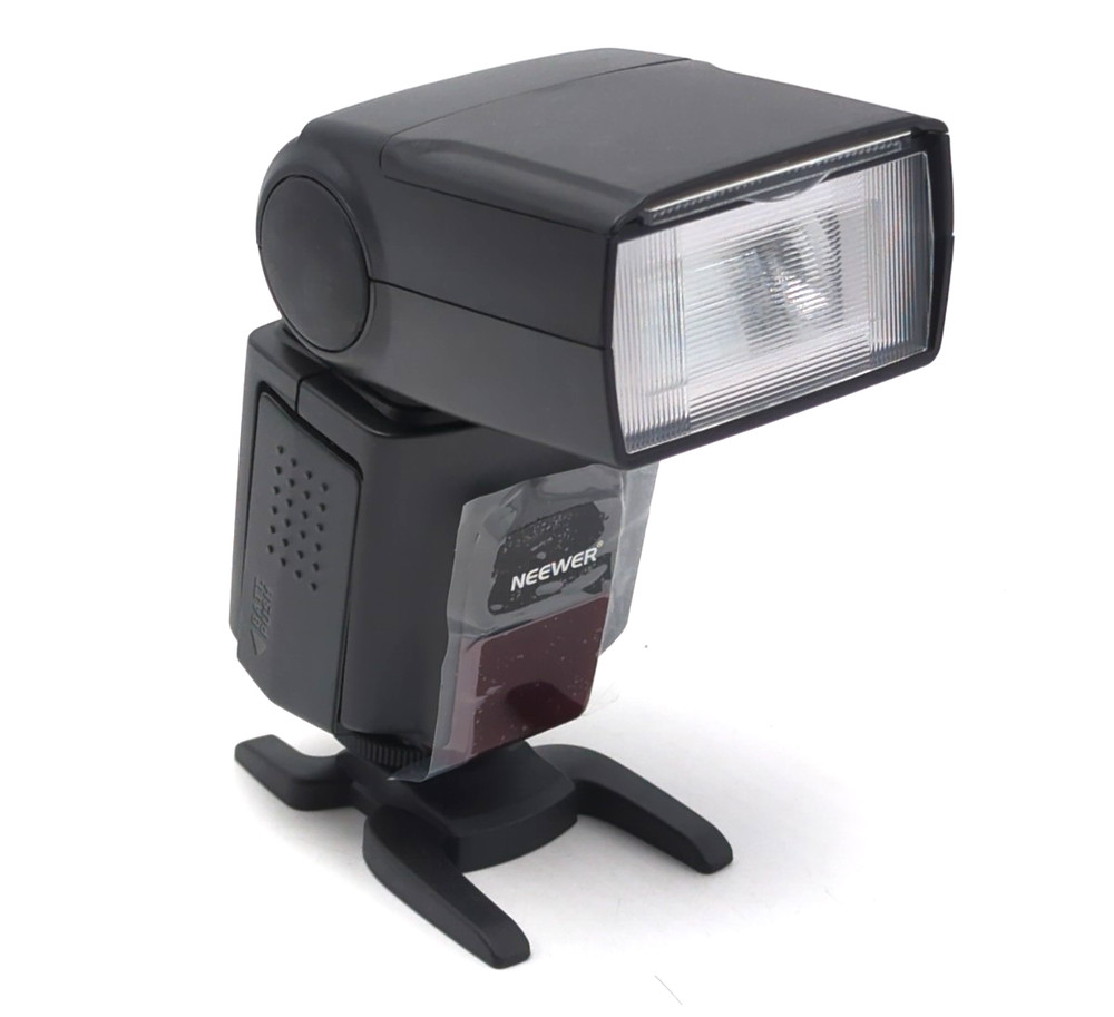 Neewer TT560 Electronic Flash Speedlite w/ pouch, box. Unused