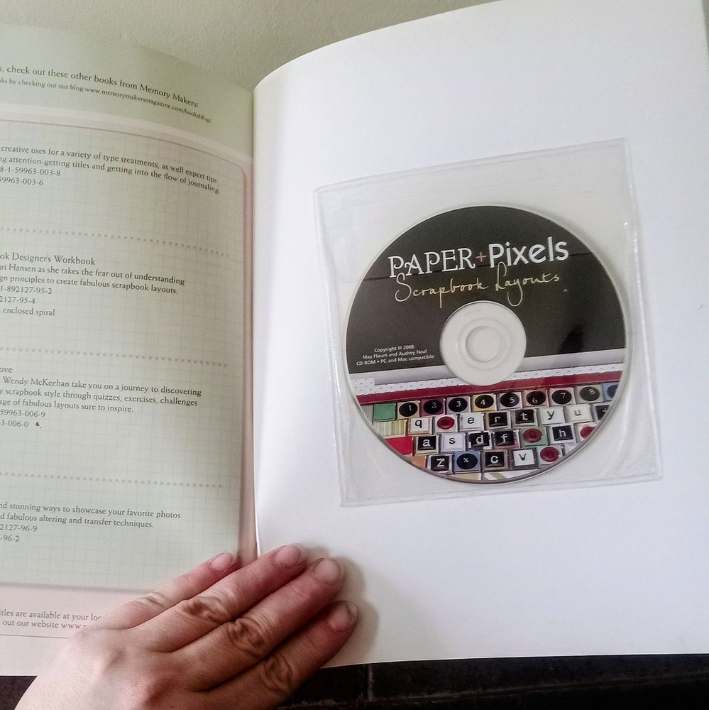 two scrapbooking instructional/layout books. one has program CD included.