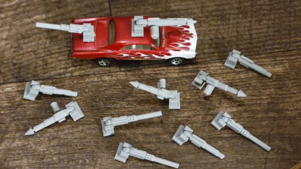 Adjustable, Moves Up or Down Weapons Pack Gray 3d printed. 1/64 scale. 11 items