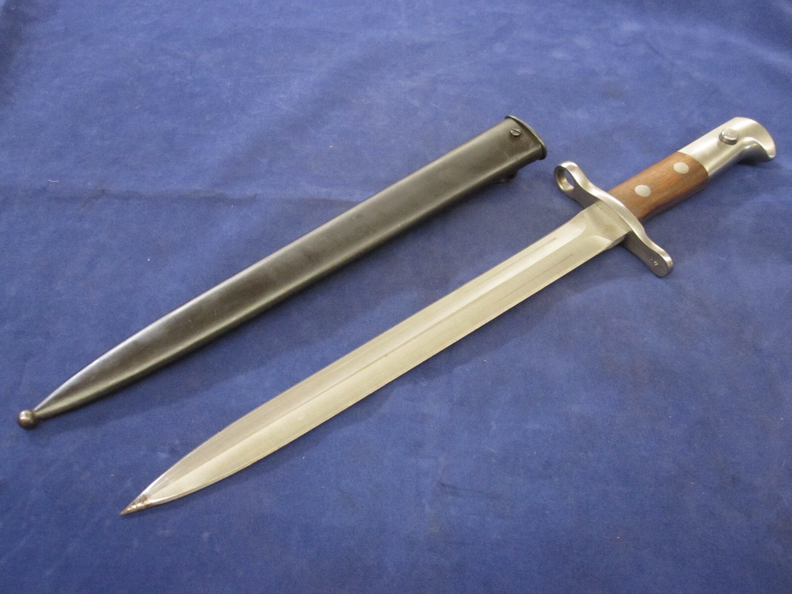 One Swiss K31 Bayonet with Scabbard - No Serials, Unissued - Blemished.
