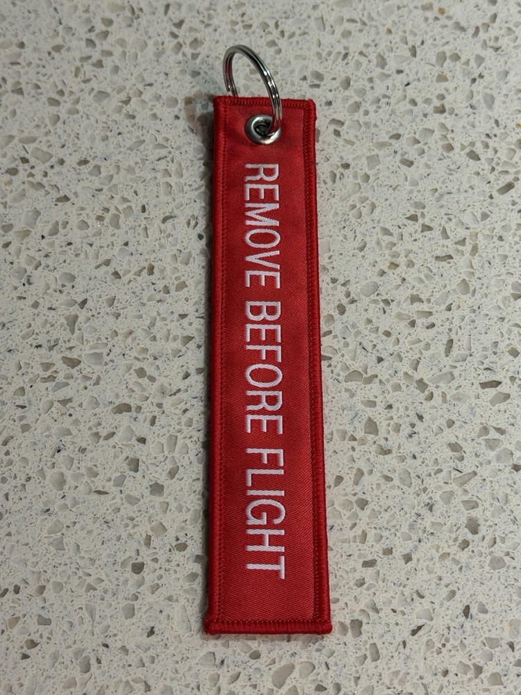 Pre-Owned Red SpaceX Falcon 9 Rocket Remove Before Flight Keychain Zipper Pull