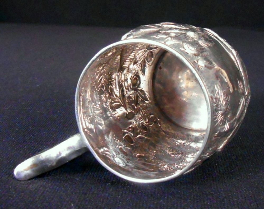 A solid silver child's mug, architectural repousse, S. Kirk & Son, 11 oz, c.1860