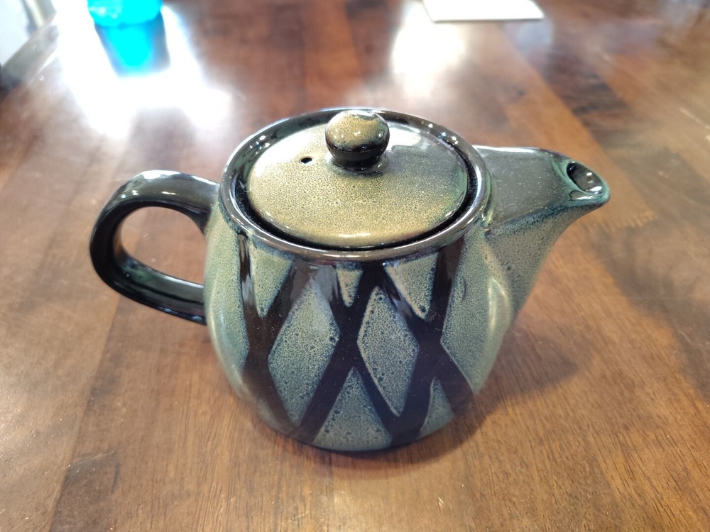 black with green ceramic teapot