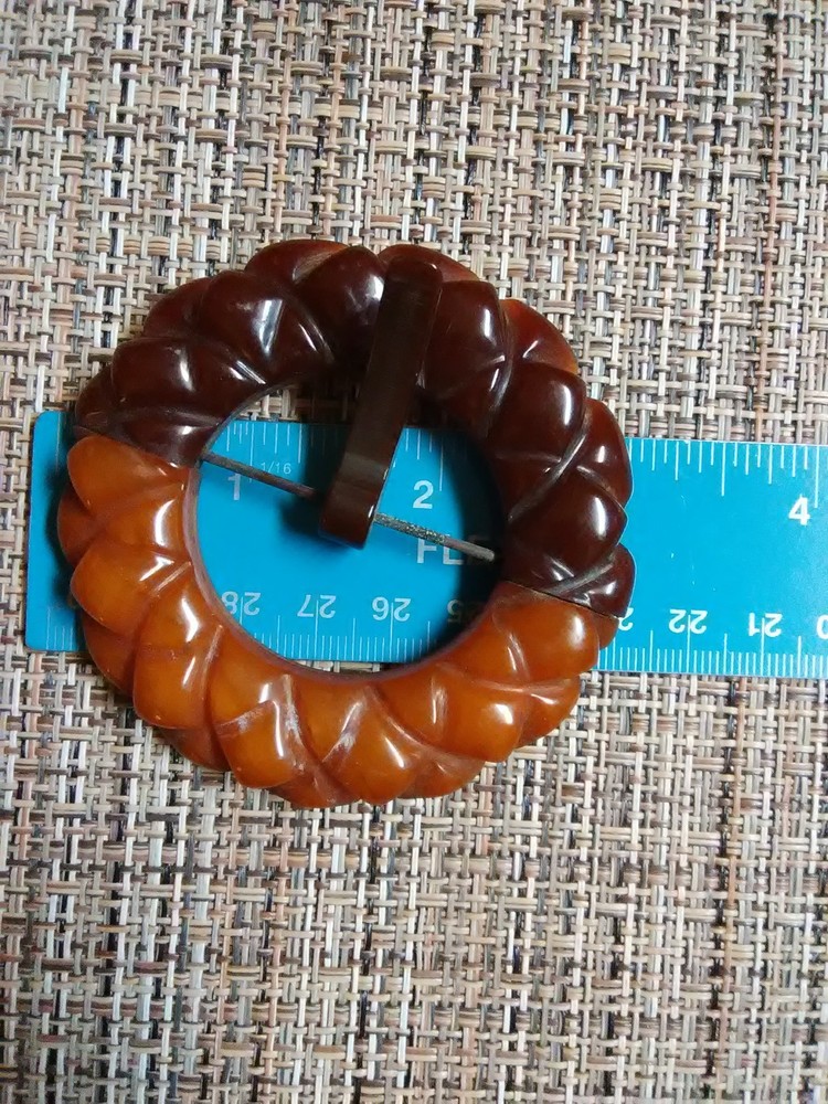 Carved Bakelite buckle