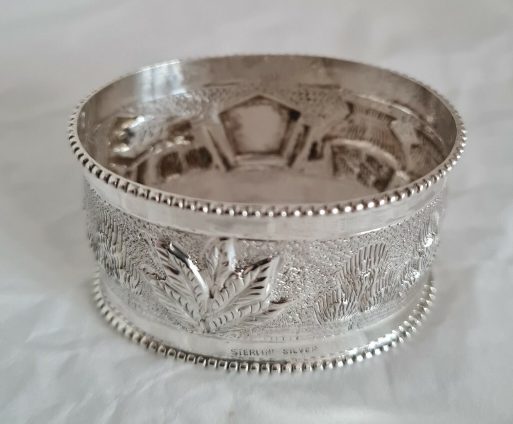 Antique oriental Napkin ring . Marked Sterling silver.