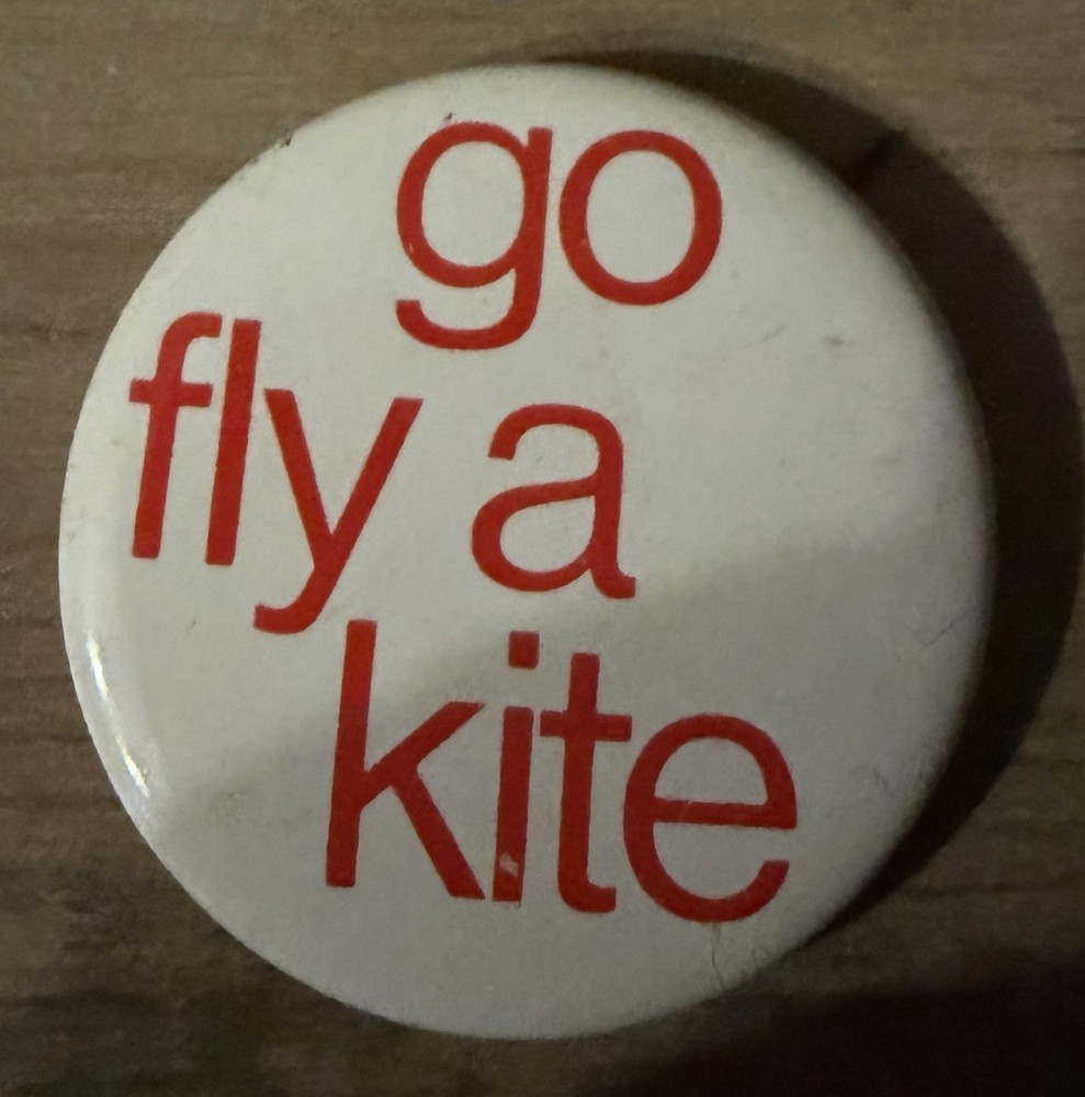 Vintage “Go Fly A Kite” Pinback Button. 1.75” (3/11)