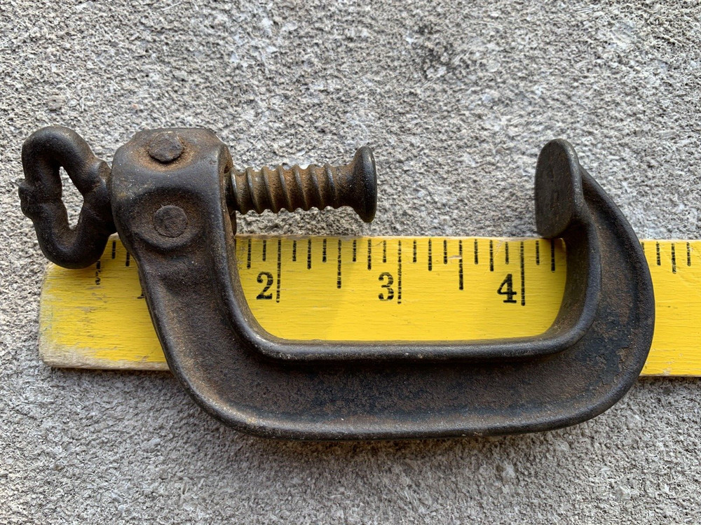 Small iron clamp held together with pins