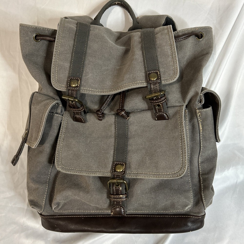 Cargoit Gray Canvas Backpack Magnetic Closures Pockets Straps and A Deep Inside
