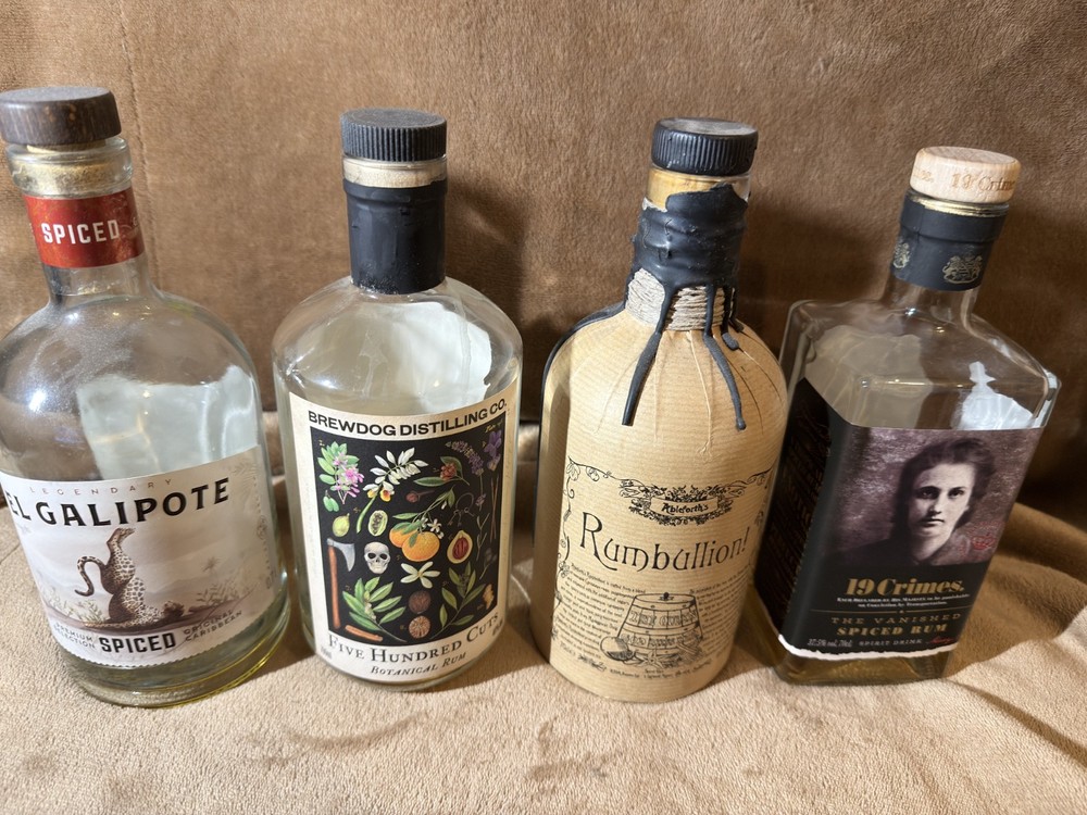 4 EMPTY RUM BOTTLES MIXTURE