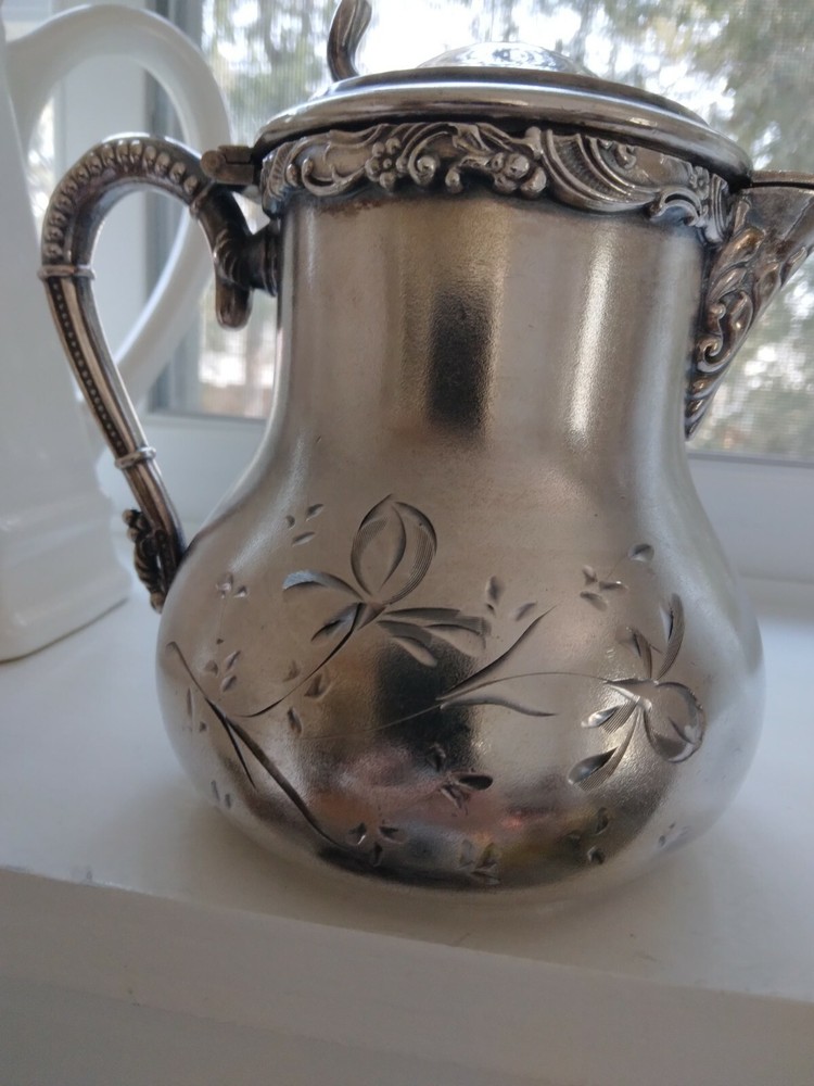 Beautiful small antique silver plated or silver pitcher.