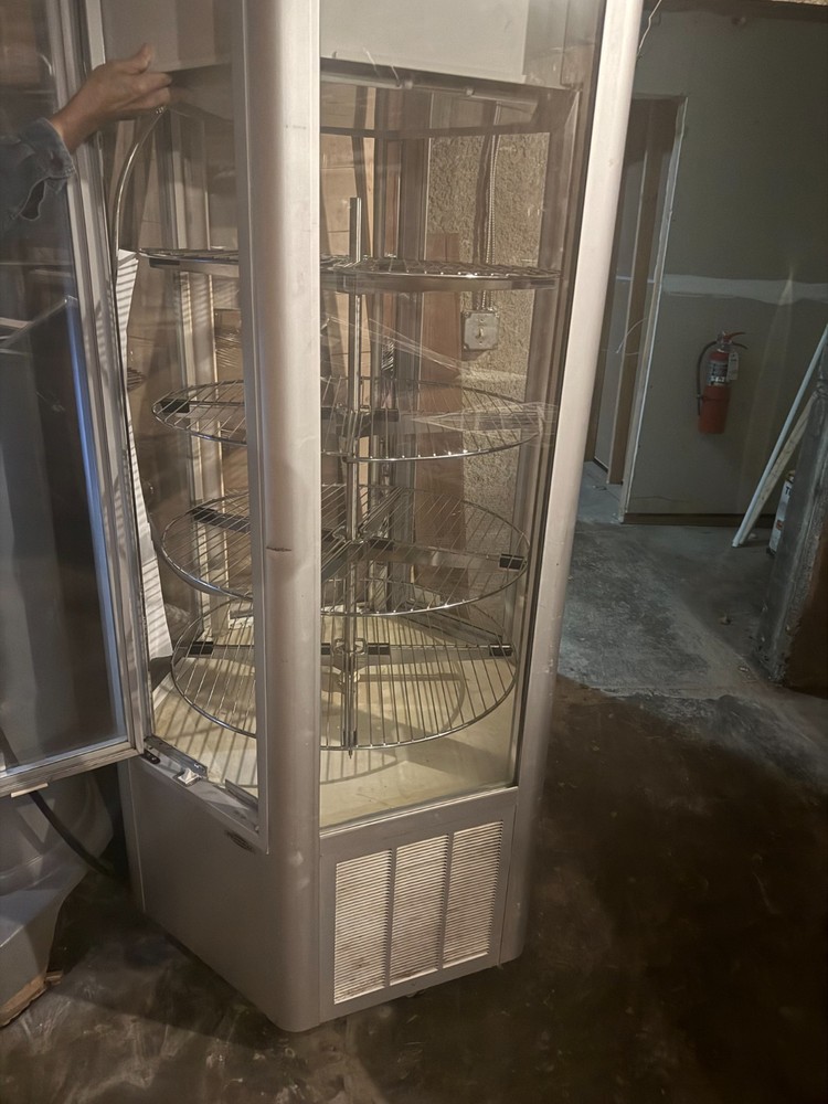 Rotating, refrigerated food display case