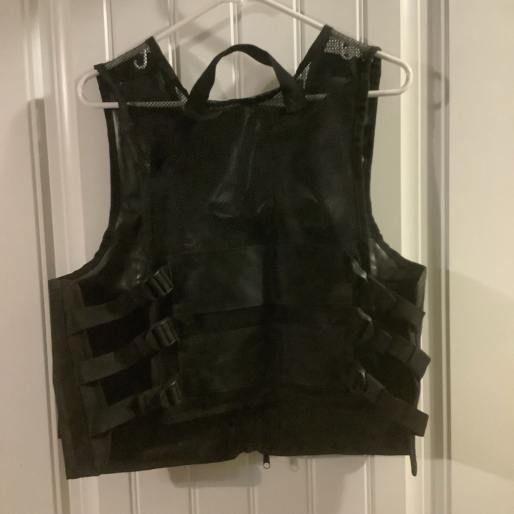 Large Black Nylon Tactical utility Vest Adjustable with Multiple Pockets.