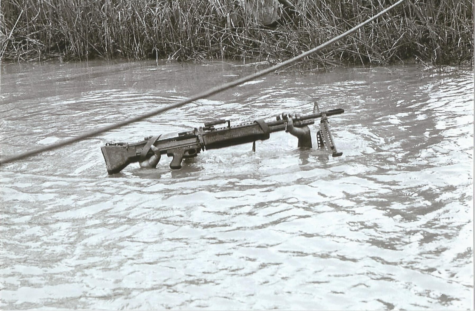 Vietnam  War  Photos --  Soldier Crossing River